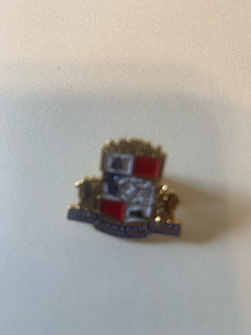Gold Crest Enamel Game Pin - Red, Blue, White